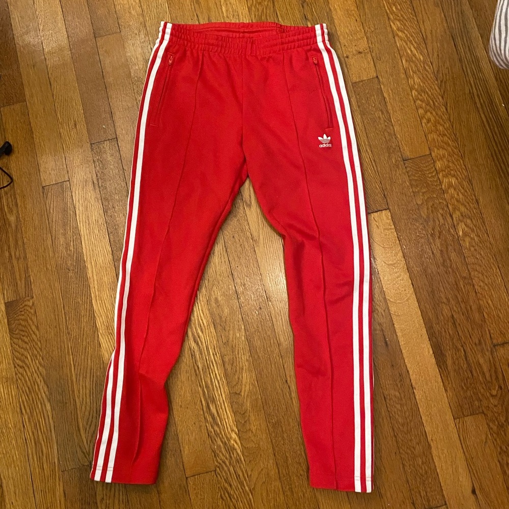 Red adidas track pants